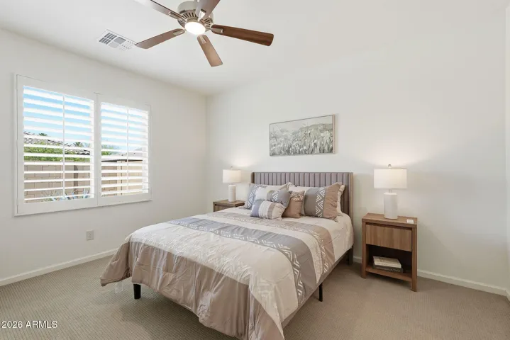 Primary bedroom has a Queen size bed and easily could fit a King Size bed. Lots of room for a dresser