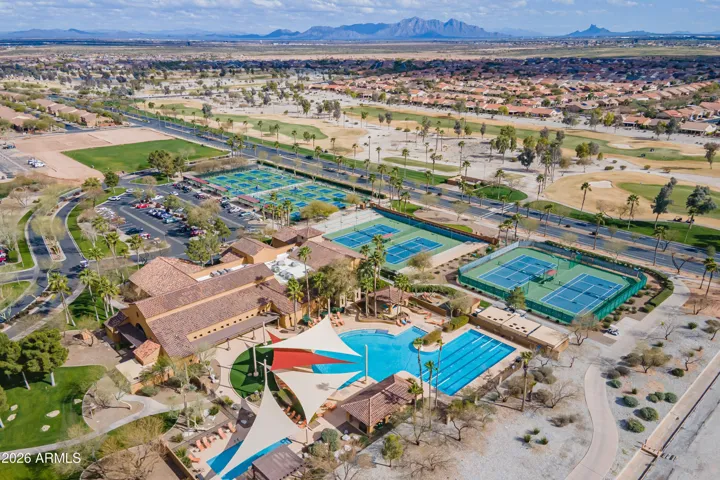 Aerial view of the amenities, pools, pickleball courts, golf course, dog park