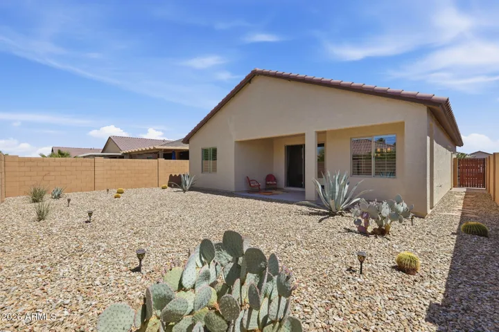 View of the backyard. The backyard is fully enclosed