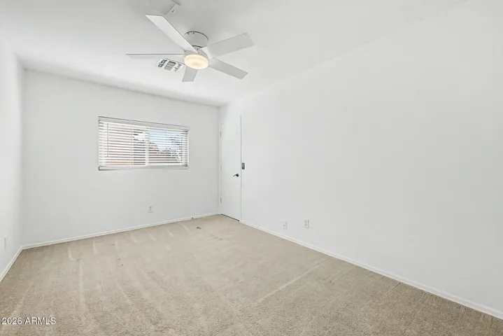 Additional bedroom ideal for guests, office, or workout room - includes a spacious walk-in closet.