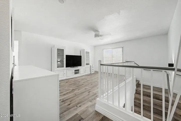 Versatile loft space perfect for media room, game room, or home office.