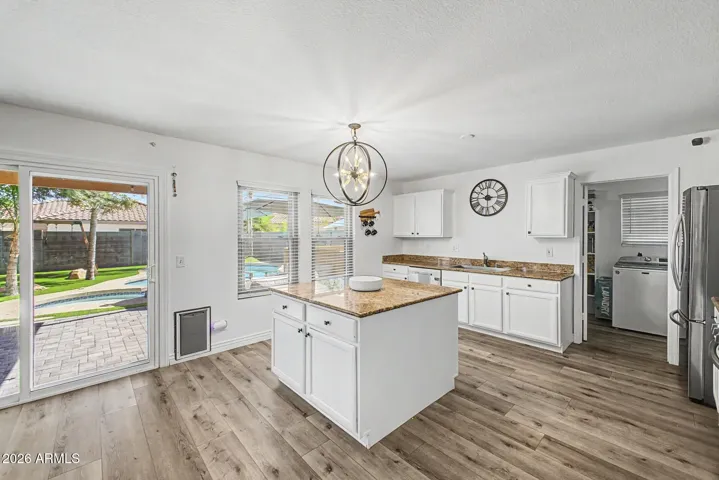 Open-concept kitchen perfectly positioned for indoor/outdoor entertaining