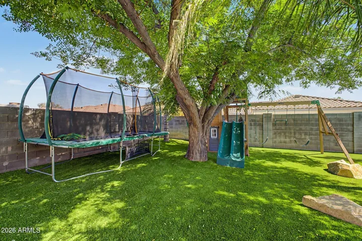 Spacious grassy area ideal for play, pets, or additional outdoor activities.