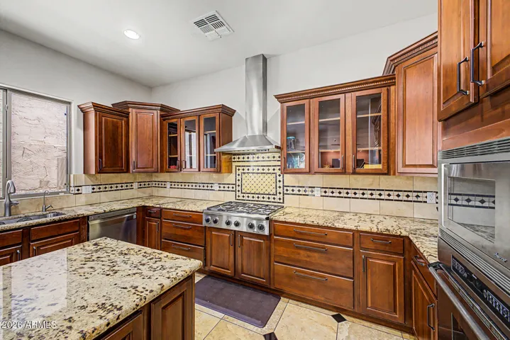 6-burner gas stove, built-in wall oven & custom cabinetry