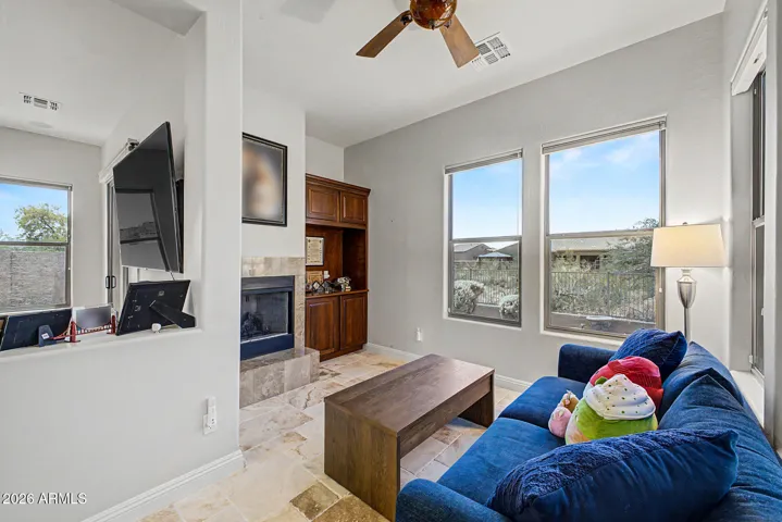 Sitting area off of primary bedroom has a fireplace, coffee bar & fridge for your convenience