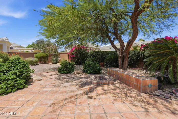 Backyard has built-in gas BBQ and fire pit.