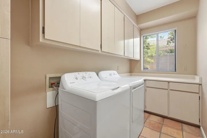 Laundry room with cabinets