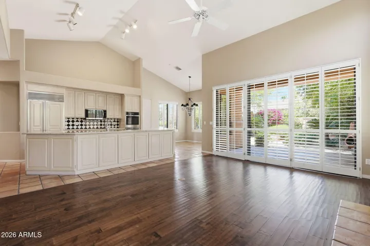 Family room open to kitchen and with doors to covered patio