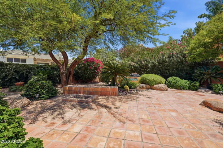 Backyard has built-in gas BBQ and fire pit.