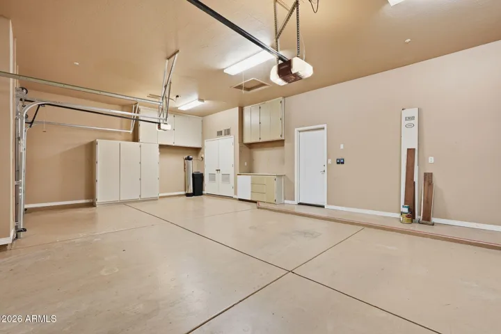 3 car Garage with epoxy floor, cabinets, water softener.