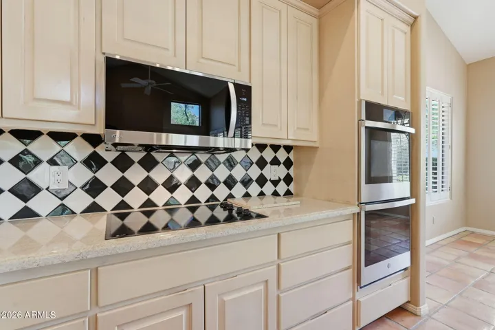Kitchen has upgraded stainless appliances, double wall ovens, subzero refrigerator.