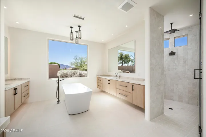 Split sinks, quartz coutertops, black chrome fixtures