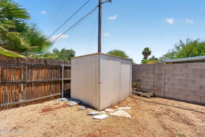 Large backyard with turf, large workshop with power and lighting, storage shed, RV gate & parking, NO HOA, low maintenance.