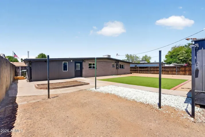 Large backyard with turf, large workshop with power and lighting, storage shed, RV gate & parking, NO HOA, low maintenance.