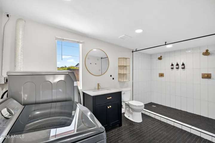 Primary suite bathroom, renovated, dual head walk in shower.