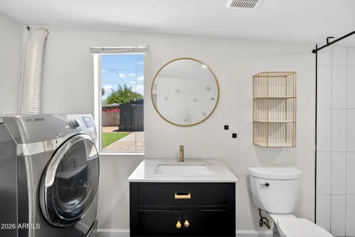 Primary suite bathroom, renovated, dual head walk in shower.