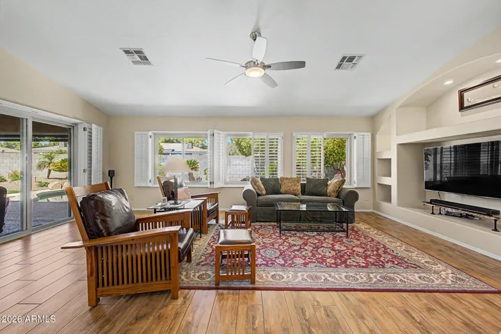 Spacious Living Room with Exit to Backyard and Close to the Kitchen.