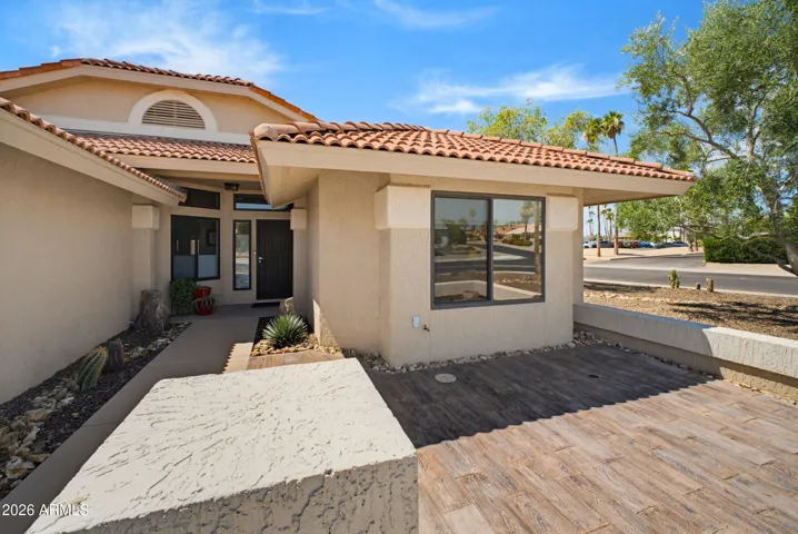 Wood-Plank Tile grace the front patio surface. Good for watching fireworks from Briarwood CC!
