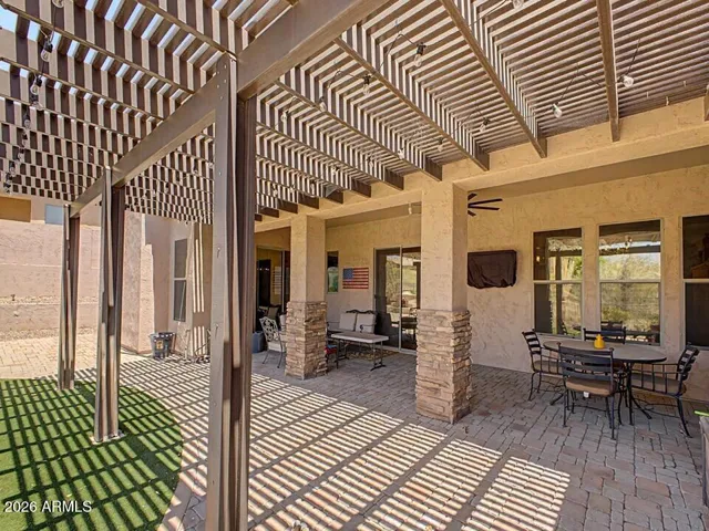 Expansive covered paver patio creates an exceptional outdoor living space