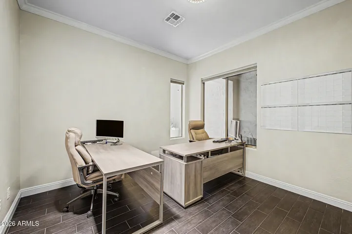 Large office space with double doors for privacy located just off of the foyer