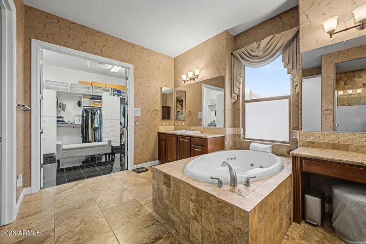 Access your large walk-in from the spa-like bathroom