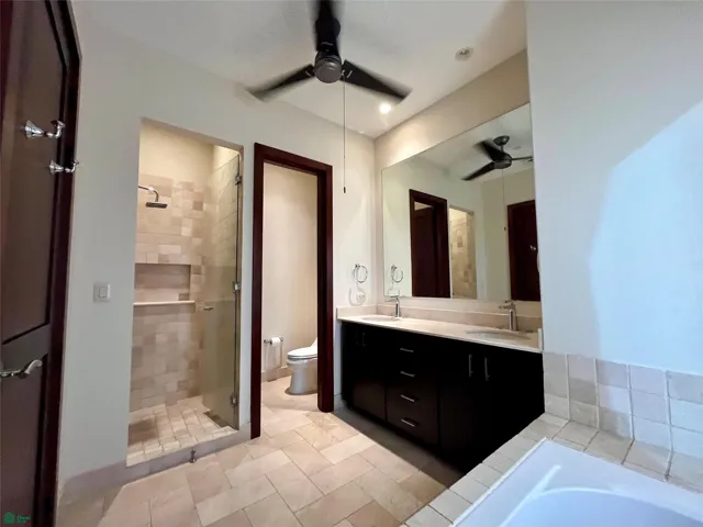 Main bathroom with tub and private, air con and​​‌​​​​‌​​‌‌​‌‌​​​‌‌​‌​‌​‌​​​‌​​ fan.