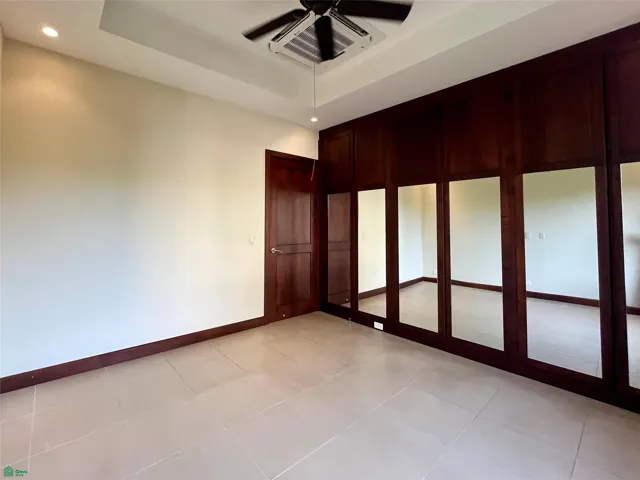 Second bedroom with split air conditioner, ceiling fan, mirrored aromatic cedar closet and wheelchair accesible door.