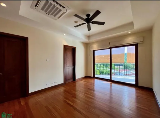 Main bedroom boasts almond wood flooring, access to the terrace, ample closet, split air con unit and ceiling fan.