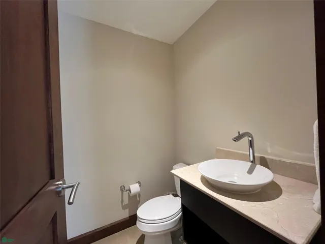 Half bathroom in the living area for guests.
