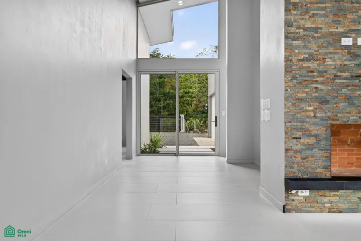 Distinctive L-shaped fireplace creating a striking architectural centerpiece