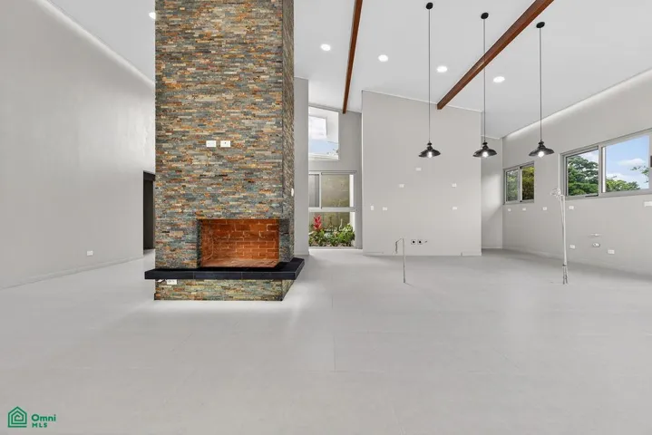 Modern architectural design integrated into the natural surroundings at the base of Volcán Tenorio
