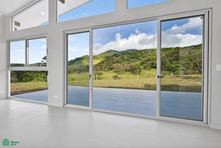 Distinctive L-shaped fireplace creating a striking architectural centerpiece.
