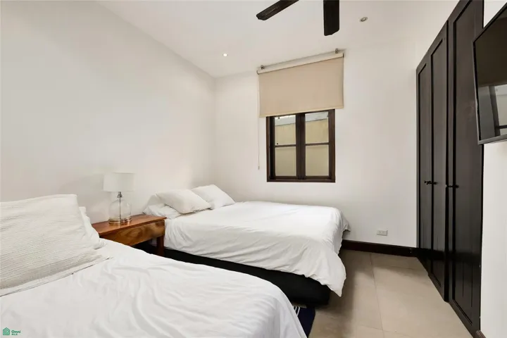 Secondary bedroom with twin and queen beds