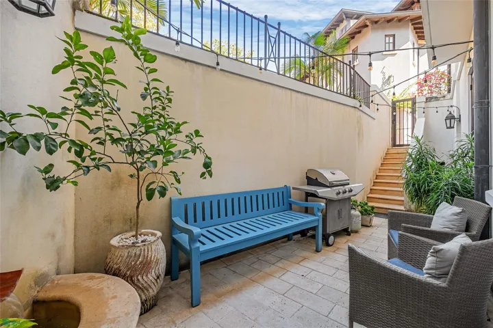Private gated patio with propane grill and fountain