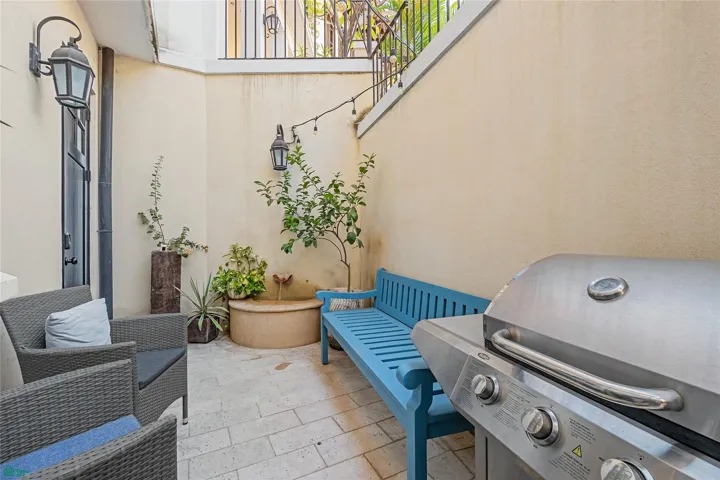Private gated patio with propane grill and fountain