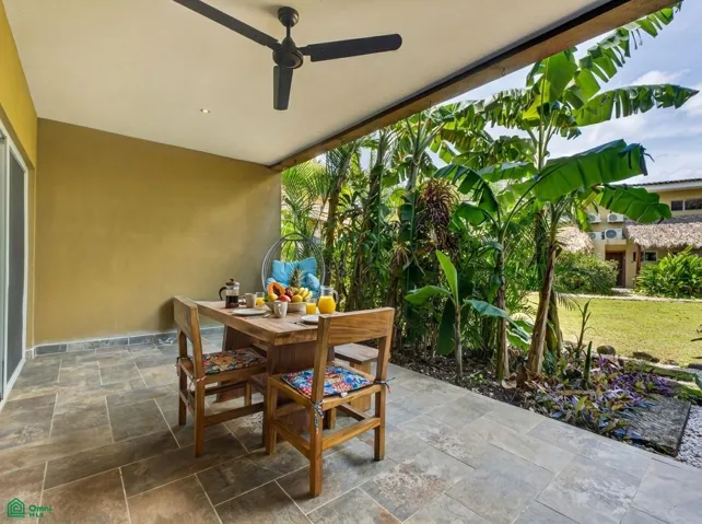Private terrace with tropical surroundings and privacy rather than looking directly onto a parking or traffic area.
