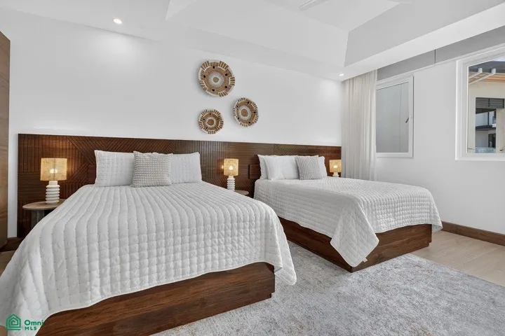 guest bedroom on 2nd floor with ensuite bathroom and 2 queen beds