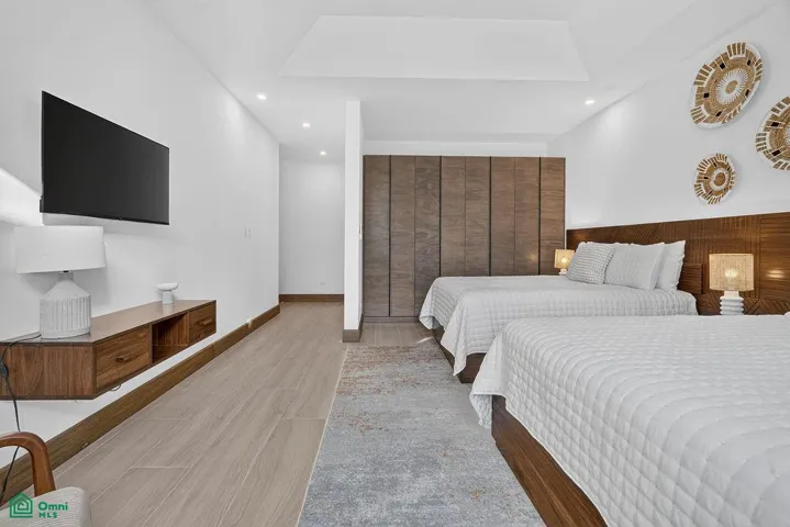 guest bedroom on 2nd floor with ensuite bathroom and 2 queen beds