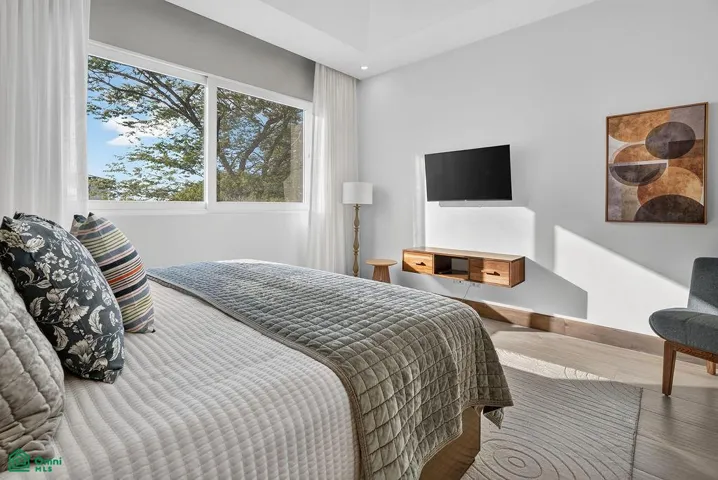 guest bedrooom on 2nd floor with ensuite bathroom and king sized bed