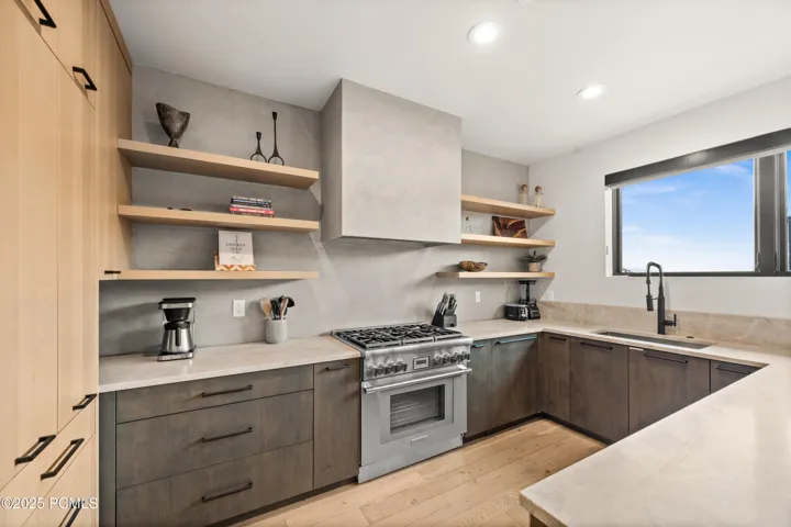 The wide countertops, peninsula and 6-top stove allow plenty of room for appliances, cooking and noshing with the family or friends.