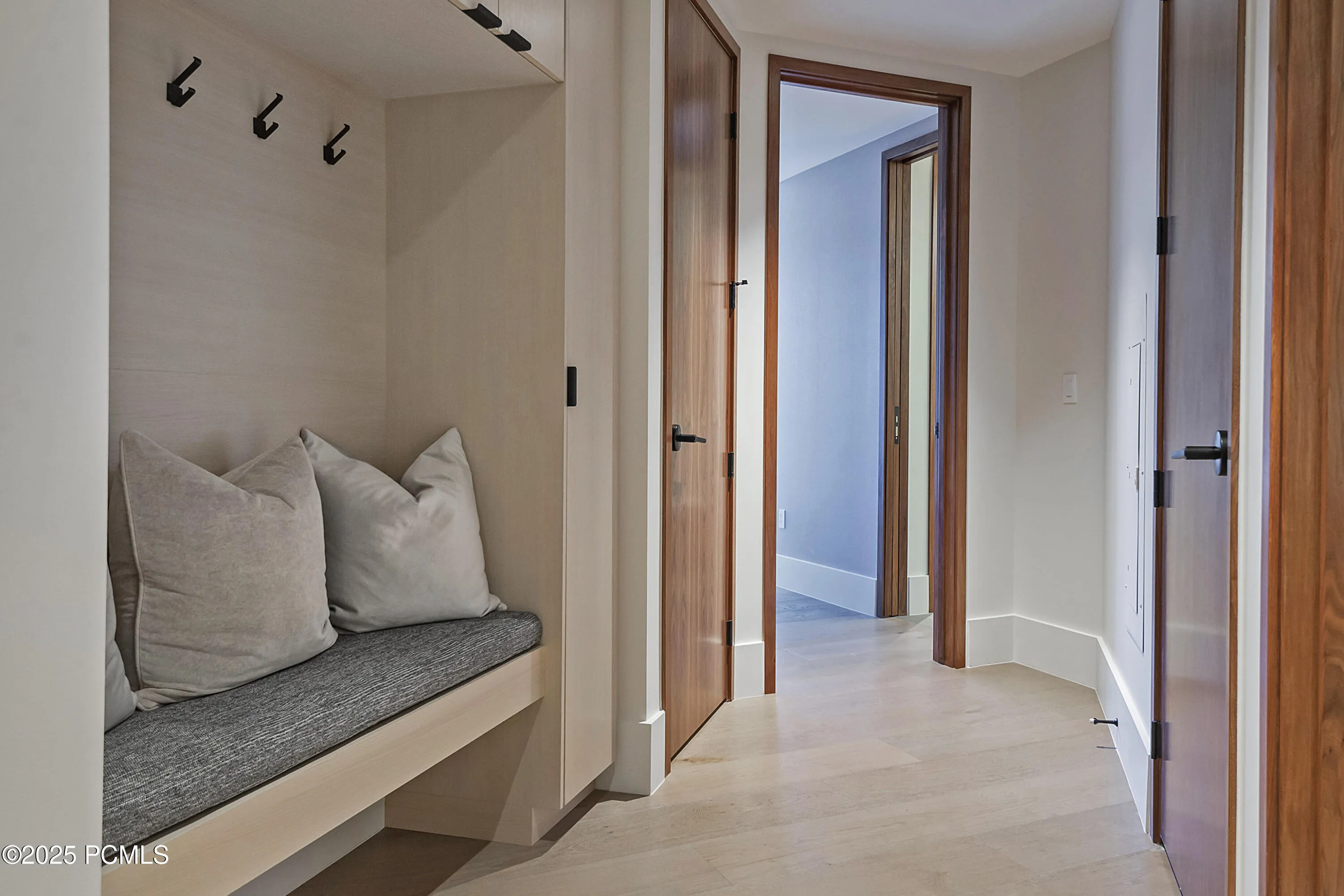 entry with bench and storage