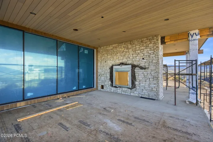 Main level deck featuring BBQ, gas fireplace and outdoor built in speakers