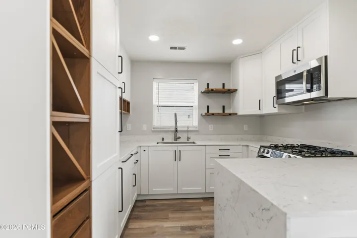 Custom Kitchen with Waterfall edge countertops