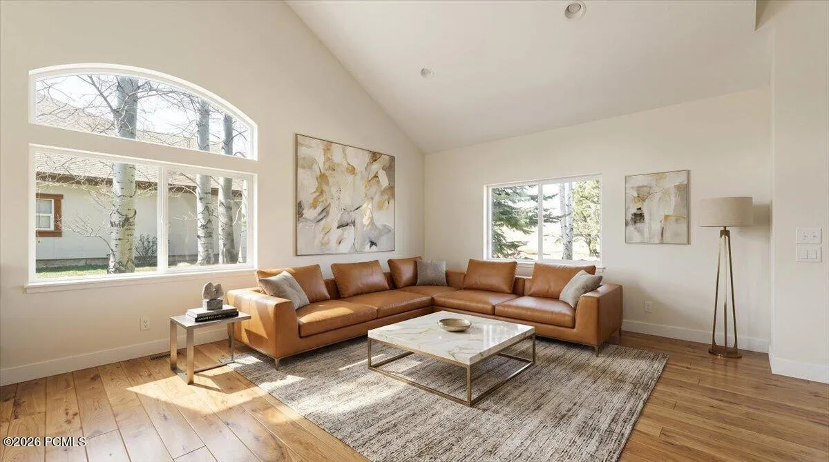 Virtually Staged. Living Room with Vaulted Ceilings and large windows