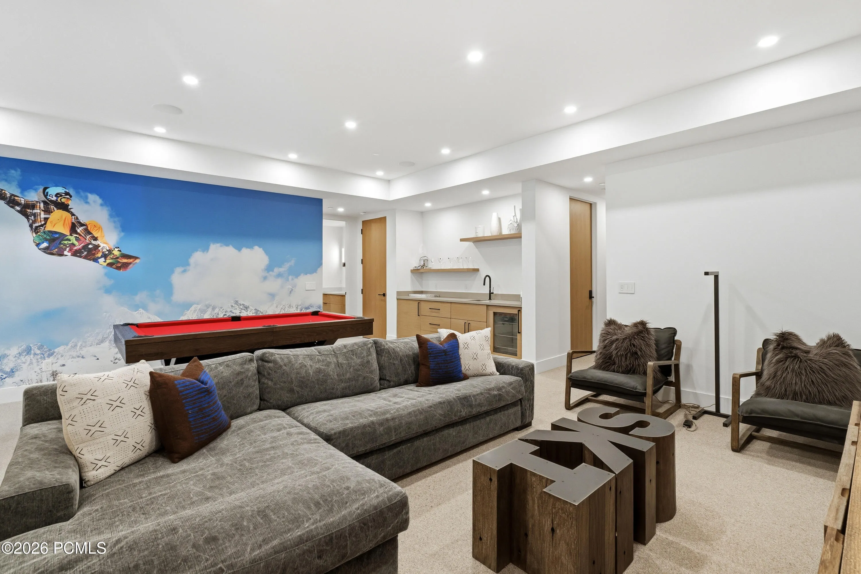 Entertainment room featuring pool table, sitting area, recessed lighting, and wet bar