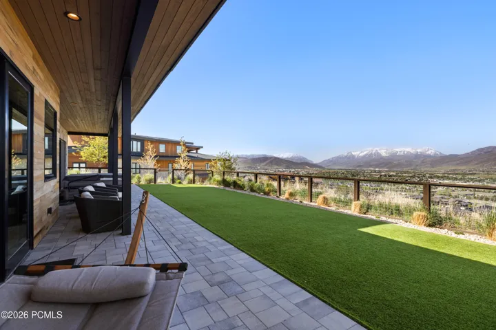 Large Lower Patio with Flat Yard and No Maintenance Turf