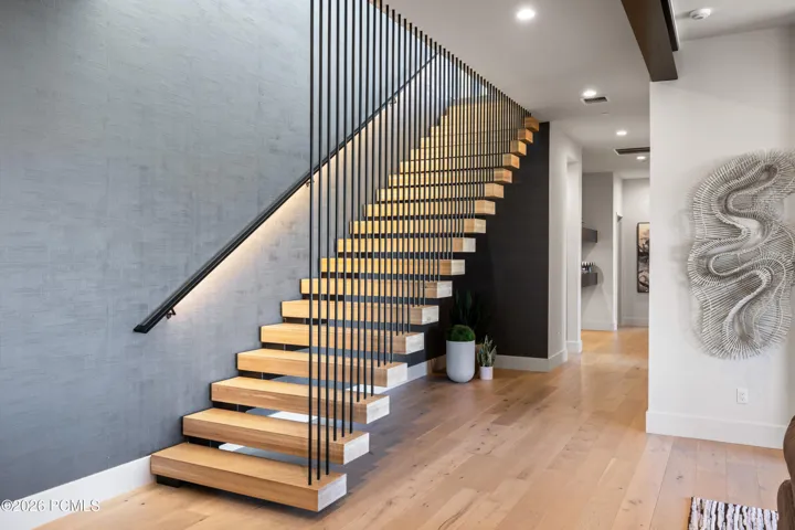 Dramatic Staircase Connects the Main and Lower Levels