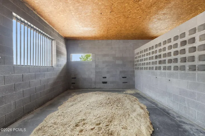 Main Breeding / Veterinary Barn, Attached/connected to the main home; includes indoor wash rack, stocks, phantom, breeding/veterinary lab, rubber mats, and indoor hot walker. 13 stalls