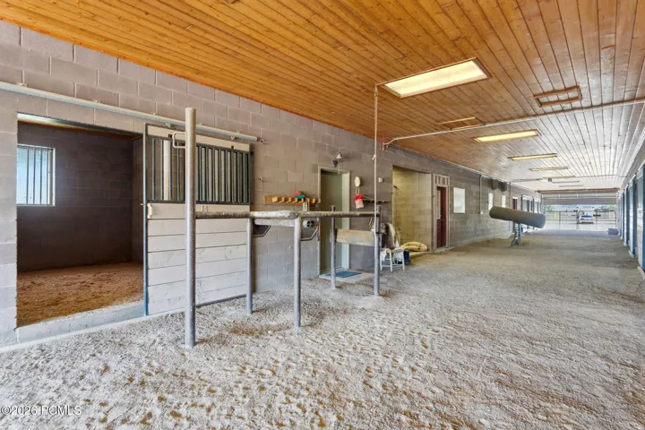 Main Breeding / Veterinary Barn, Attached/connected to the main home; indoor wash rack, stocks, phantom, breeding/veterinary lab, rubber mats, and indoor hot walker. 13 stalls