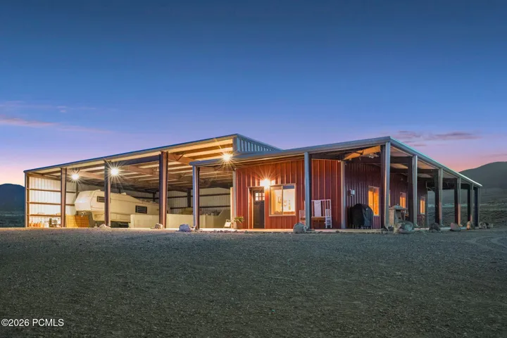 Detached ADU & Ranch Support Building 50' x 120' Approx. 6,000 sq ft total building footprint. Includes two living quarters: a 2-bed/1-bath apartment and a studio, plus RV storage, RV hookups & dumps, Septic tank, and equipment/storage space.
